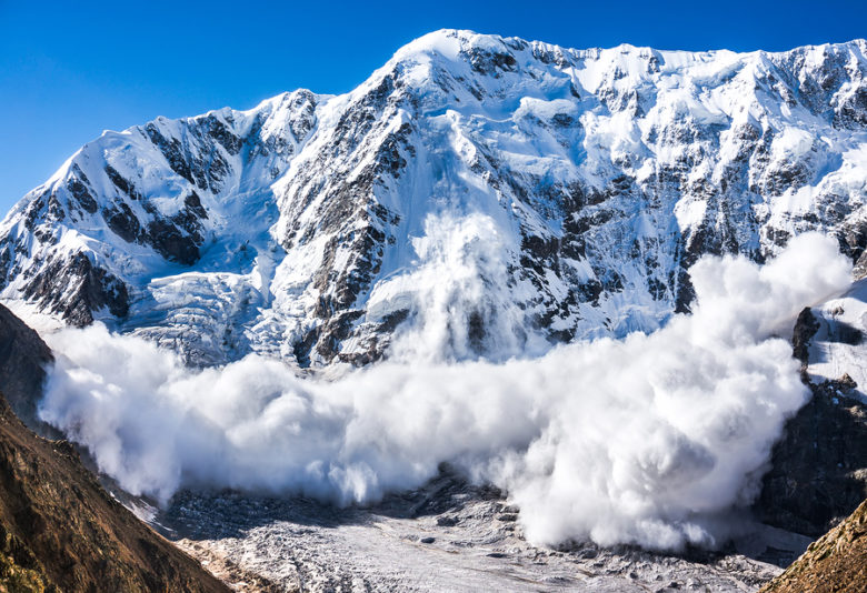 Power of nature. Real huge avalanche comes from a big mountain